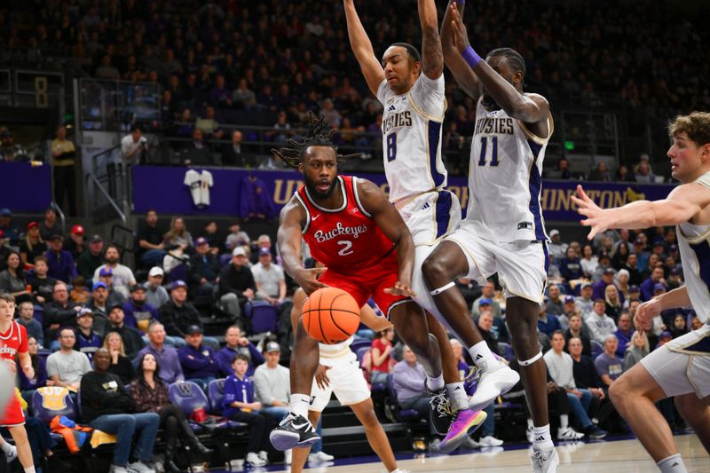 Jan 11, 2026; Seattle, Washington, USA; Ohio State Buckeyes guard Bruce Thornton (2) passes the ball while guarded by Washington Huskies forward Bryson Tucker (8) and Washington Huskies center Franck Kepnang (11) during the second half at Alaska Airlines Arena at Hec Edmundson Pavilion. Mandatory Credit: Steven Bisig-Imagn Images