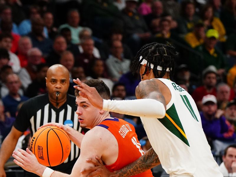 Mar 24, 2024; Memphis, TN, USA; Clemson Tigers guard Joseph Girard III (11) controls the ball against Baylor Bears forward Jalen Bridges (11) in the second half in the second round of the 2024 NCAA Tournament at FedExForum. Mandatory Credit: John David Mercer-USA TODAY Sports