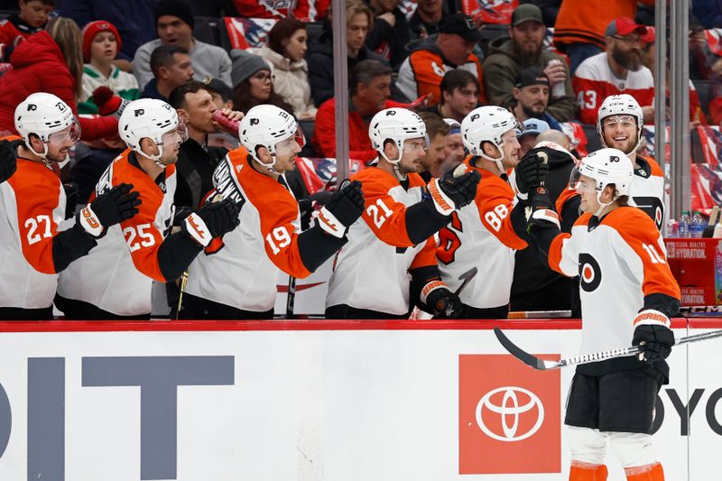 Mar 1, 2024; Washington, District of Columbia, USA; Philadelphia Flyers right wing Bobby Brink (10) celebrates with teammates after scoring a goal against the Washington Capitals in the first period at Capital One Arena. Mandatory Credit: Geoff Burke-USA TODAY Sports