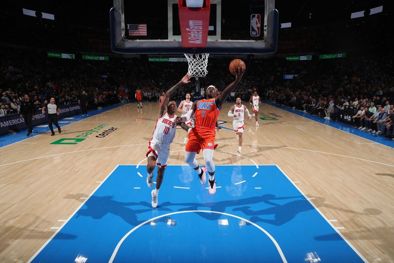 OKLAHOMA CITY, OK - FEBRUARY 27: Luguentz Dort #5 of the Oklahoma City Thunder drives to the basket during the game against the Houston Rockets on February, 2024 at Paycom Arena in Oklahoma City, Oklahoma. NOTE TO USER: User expressly acknowledges and agrees that, by downloading and or using this photograph, User is consenting to the terms and conditions of the Getty Images License Agreement. Mandatory Copyright Notice: Copyright 2024 NBAE (Photo by Zach Beeker/NBAE via Getty Images)