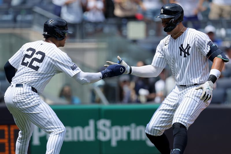 Aug 3, 2024; Bronx, New York, USA; New York Yankees designated hitter Aaron Judge (99) celebrates his two run home run against the Toronto Blue Jays with right fielder Juan Soto (22) during the first inning at Yankee Stadium. Mandatory Credit: Brad Penner-USA TODAY Sports