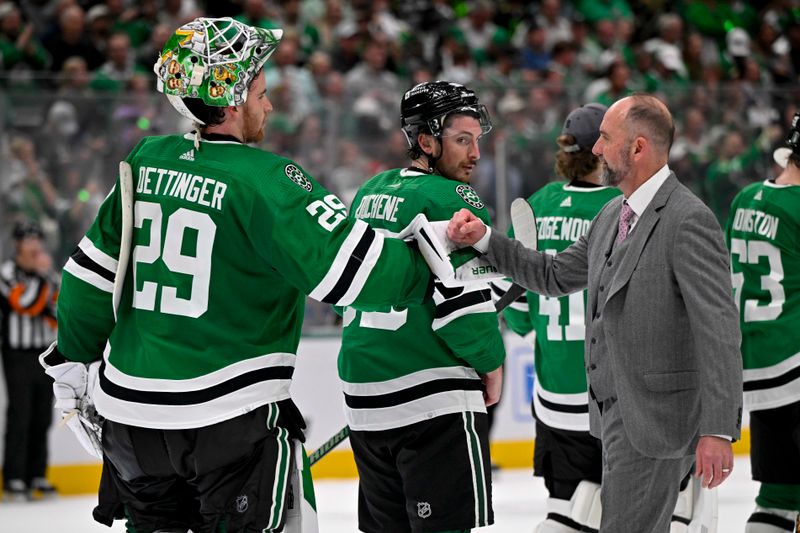 May 5, 2024; Dallas, Texas, USA; Dallas Stars head coach Peter DeBoer gives a fist bump to goaltender Jake Oettinger (29) after the Stars defeat the Vegas Golden Knights in game seven of the first round of the 2024 Stanley Cup Playoffs at American Airlines Center. Mandatory Credit: Jerome Miron-USA TODAY Sports