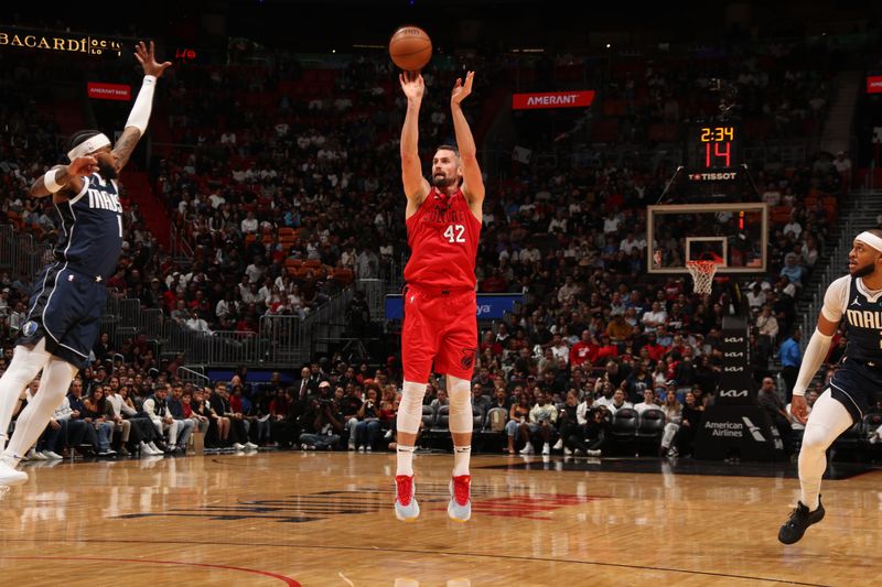 MIAMI, FL - NOVEMBER 24: Kevin Love #42 of the Miami Heat shoots a three point basket during the game against the Dallas Mavericks on November 24, 2024 at Kaseya Center in Miami, Florida. NOTE TO USER: User expressly acknowledges and agrees that, by downloading and or using this Photograph, user is consenting to the terms and conditions of the Getty Images License Agreement. Mandatory Copyright Notice: Copyright 2024 NBAE (Photo by Issac Baldizon/NBAE via Getty Images)