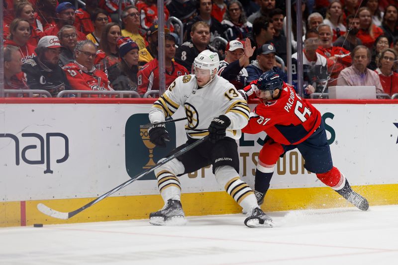 Apr 15, 2024; Washington, District of Columbia, USA; Boston Bruins center Charlie Coyle (13) and Washington Capitals left wing Max Pacioretty (67) battle for the puck in the first period at Capital One Arena. Mandatory Credit: Geoff Burke-USA TODAY Sports