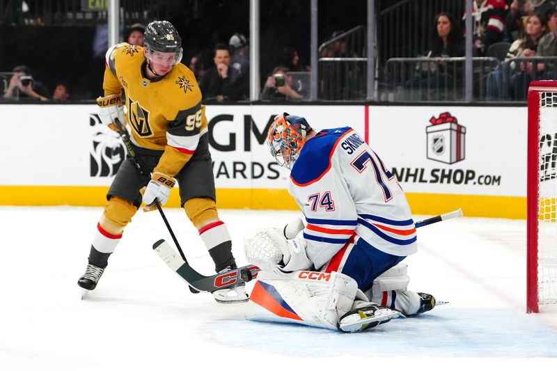 Dec 3, 2024; Las Vegas, Nevada, USA; Edmonton Oilers goaltender Stuart Skinner (74) makes a save as Vegas Golden Knights right wing Victor Olofsson (95) looks for a rebound during the second period at T-Mobile Arena. Mandatory Credit: Stephen R. Sylvanie-Imagn Images