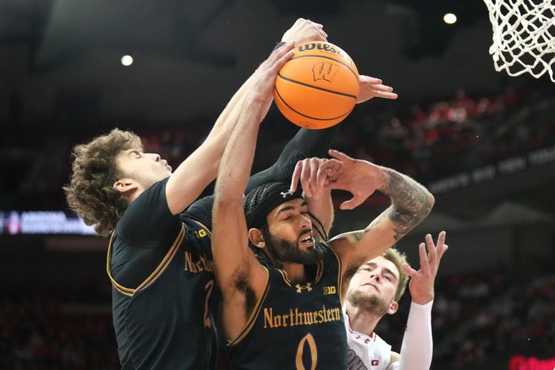 Jan 13, 2024; Madison, Wisconsin, USA; Northwestern Wildcats forward Nick Martinelli (2) and guard Boo Buie (0) fight for a rebound with Wisconsin Badgers forward Tyler Wahl (5) during the second half at the Kohl Center. Mandatory Credit: Kayla Wolf-USA TODAY Sports