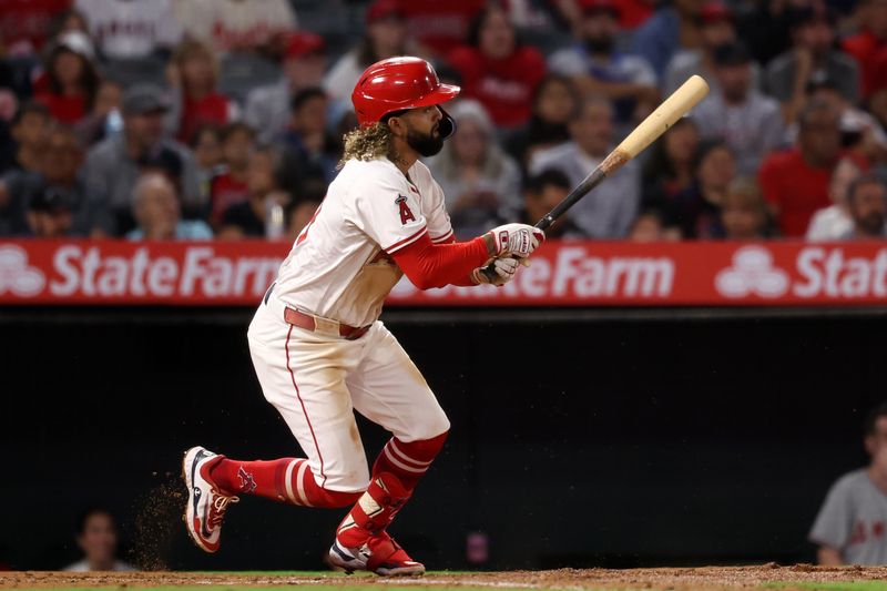 Sep 28, 2024; Anaheim, California, USA;  Los Angeles Angels shortstop Jack Lopez (10) hits a RBI single during the second inning against the Texas Rangers at Angel Stadium. Mandatory Credit: Kiyoshi Mio-Imagn Images