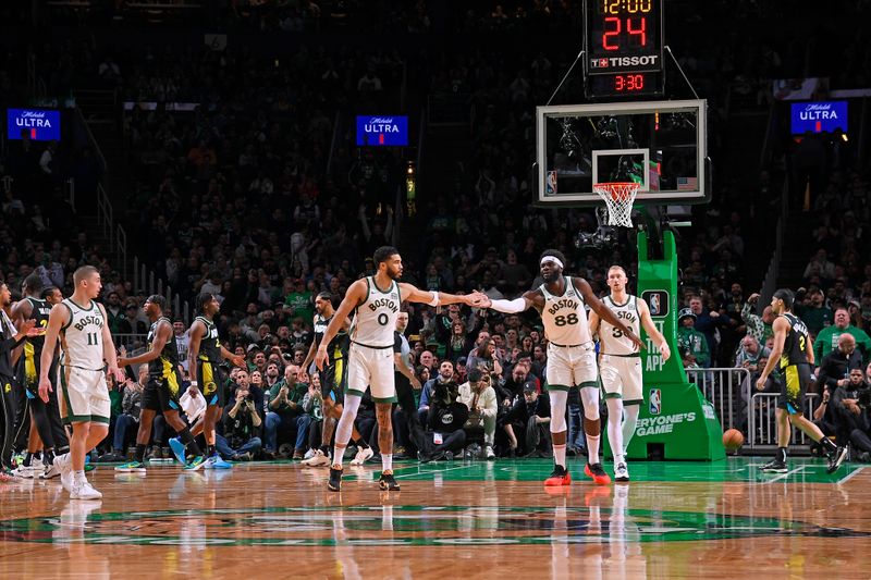 BOSTON, MA - JANUARY 30: Jayson Tatum #0 of the Boston Celtics high fives Neemias Queta #88 of the Boston Celtics during the game against the Indiana Pacers on January 30, 2024 at the TD Garden in Boston, Massachusetts. NOTE TO USER: User expressly acknowledges and agrees that, by downloading and or using this photograph, User is consenting to the terms and conditions of the Getty Images License Agreement. Mandatory Copyright Notice: Copyright 2024 NBAE  (Photo by Brian Babineau/NBAE via Getty Images)