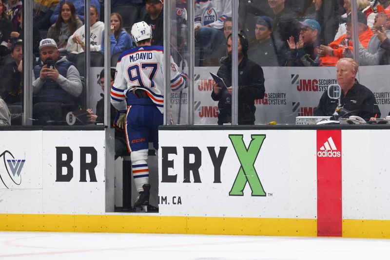 Feb 9, 2024; Anaheim, California, USA; Edmonton Oilers center Connor McDavid (97) walks into the penalty box during the first period of a game against the Anaheim Ducks at Honda Center. Mandatory Credit: Jessica Alcheh-USA TODAY Sports