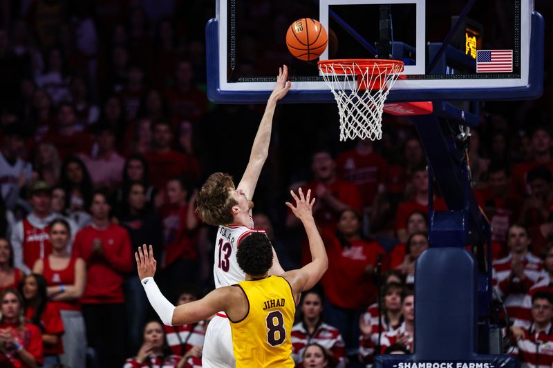 Mar 4, 2025; Tucson, Arizona, USA; Arizona State Sun Devils froward Basheer Jihad (8) fails to block Arizona Wildcats forward Henri Veesaar (13) from a layup during the first half at McKale Center. Mandatory Credit: Aryanna Frank-Imagn Images