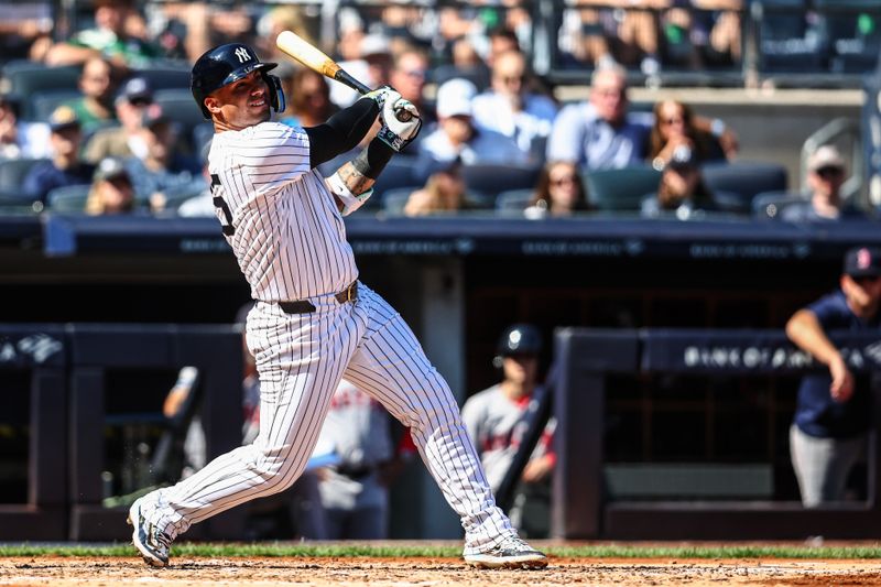 Sep 15, 2024; Bronx, New York, USA;  New York Yankees second baseman Gleyber Torres (25) hits a solo home run in the third inning against the Boston Red Sox at Yankee Stadium. Mandatory Credit: Wendell Cruz-Imagn Images