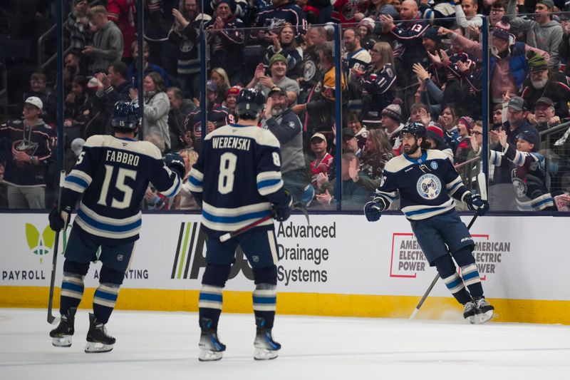 Nov 23, 2024; Columbus, Ohio, USA;  Columbus Blue Jackets right wing Kirill Marchenko (86) celebrates with teammates after scoring a goal against the Carolina Hurricanes in the first period at Nationwide Arena. Mandatory Credit: Aaron Doster-Imagn Images