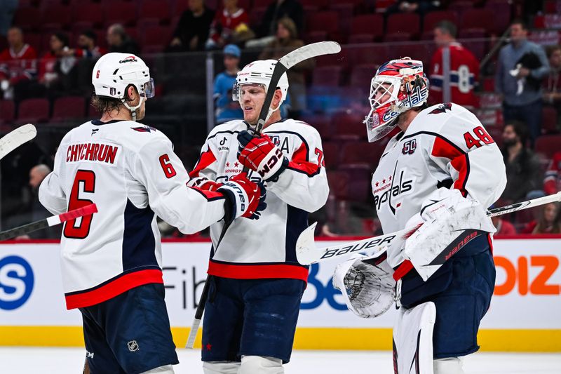 Apr 27, 2025; Montreal, Quebec, CAN; Washington Capitals goalie Logan Thompson (48), defenseman Jakob Chychrun (6) and defenseman John Carlson (74) celebrate the win against the Montreal Canadiens after the third period in game four of the first round of the 2025 Stanley Cup Playoffs at Bell Centre. Mandatory Credit: David Kirouac-Imagn Images