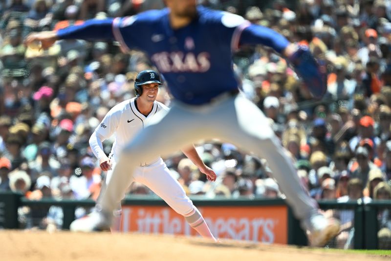 May 11, 2025; Detroit, Michigan, USA; Detroit Tigers right fielder Kerry Carpenter (30) leads off first base as Texas Rangers starting pitcher Nathan Eovaldi (17) delivers a pitch in the third inning at Comerica Park. Mandatory Credit: Lon Horwedel-Imagn Images