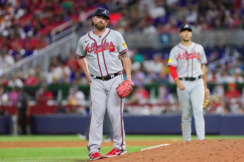 Sep 16, 2023; Miami, Florida, USA; Atlanta Braves relief pitcher Kirby Yates (22) looks on during the eighth inning against the Miami Marlins at loanDepot Park. Mandatory Credit: Sam Navarro-USA TODAY Sports