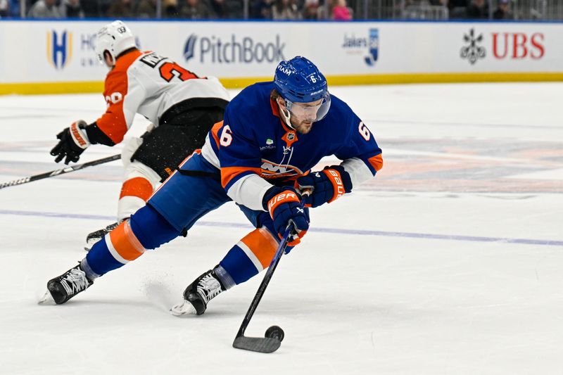Nov 28, 2025; Elmont, New York, USA; New York Islanders defenseman Ryan Pulock (6) skates with the puck against the Philadelphia Flyers during the third period at UBS Arena. Mandatory Credit: Dennis Schneidler-Imagn Images
