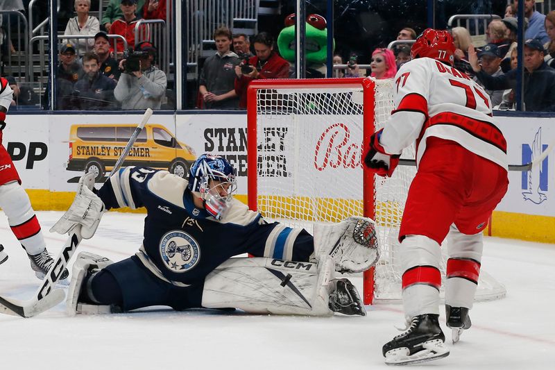 Apr 16, 2024; Columbus, Ohio, USA; Columbus Blue Jackets goalie Jet Greaves (73) makes a save on a shot by Carolina Hurricanes defenseman Tony DeAngelo (77) during the third period at Nationwide Arena. Mandatory Credit: Russell LaBounty-USA TODAY Sports