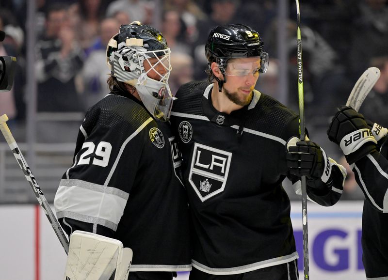 Feb 11, 2023; Los Angeles, California, USA;  Los Angeles Kings goaltender Pheonix Copley (29) is congratulated by Los Angeles Kings right wing Adrian Kempe (9) after a shutout against the Pittsburgh Penguins at Crypto.com Arena. Kempe scored four goals in the game as the first player in Kings franchise history to accomplish that record. Mandatory Credit: Jayne Kamin-Oncea-USA TODAY Sports