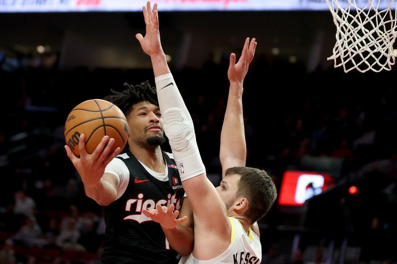 PORTLAND, OREGON - DECEMBER 06: Shaedon Sharpe #17 of the Portland Trail Blazers shoots against Walker Kessler #24 of the Utah Jazz during the second half at Moda Center on December 06, 2024 in Portland, Oregon. NOTE TO USER: User expressly acknowledges and agrees that, by downloading and or using this photograph, User is consenting to the terms and conditions of the Getty Images License Agreement. (Photo by Steph Chambers/Getty Images)