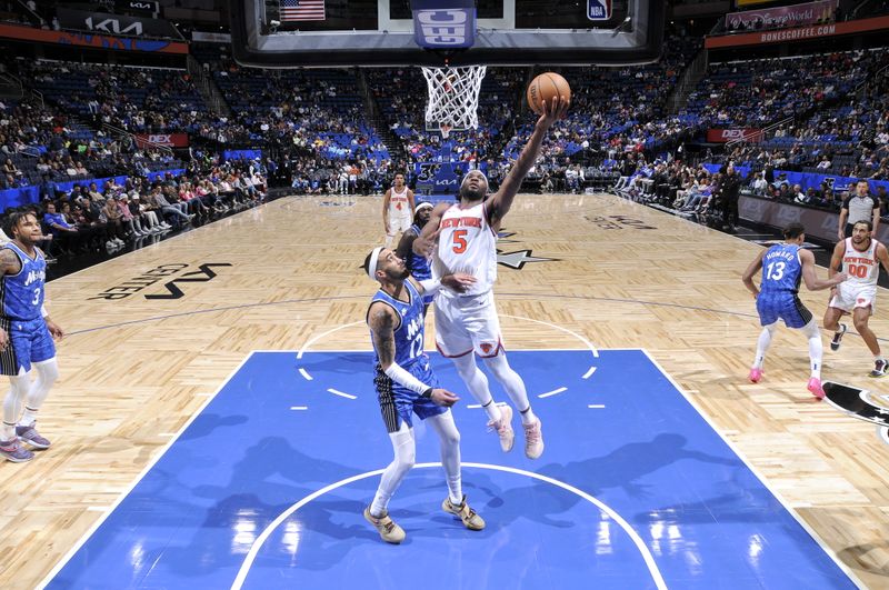 ORLANDO, FL - FEBRUARY 14: Precious Achiuwa #5 of the New York Knicks drives to the basket during the game against the Orlando Magic on February 14, 2024 at the Kia Center in Orlando, Florida. NOTE TO USER: User expressly acknowledges and agrees that, by downloading and or using this photograph, User is consenting to the terms and conditions of the Getty Images License Agreement. Mandatory Copyright Notice: Copyright 2024 NBAE (Photo by Fernando Medina/NBAE via Getty Images)