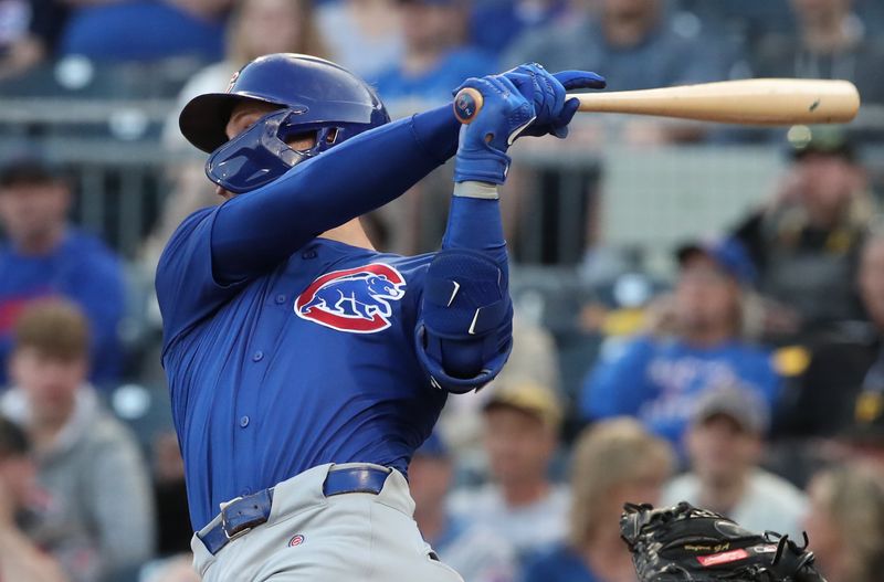 Apr 30, 2025; Pittsburgh, Pennsylvania, USA;  Chicago Cubs second baseman Nico Hoerner (2) hits a single against the Pittsburgh Pirates during the fourth inning at PNC Park. Mandatory Credit: Charles LeClaire-Imagn Images