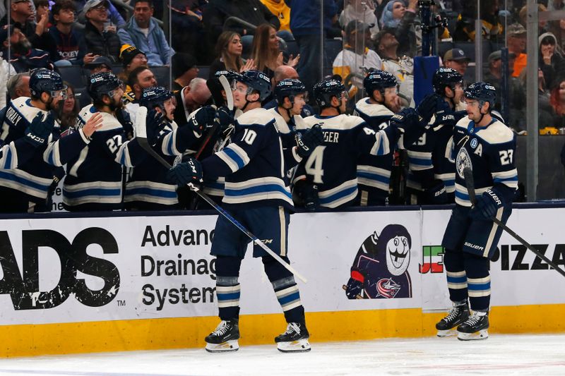 Nov 15, 2024; Columbus, Ohio, USA; Columbus Blue Jackets left wing Dmitri Voronkov (10) celebrates his goal against the Pittsburgh Penguins during the third period at Nationwide Arena. Mandatory Credit: Russell LaBounty-Imagn Images