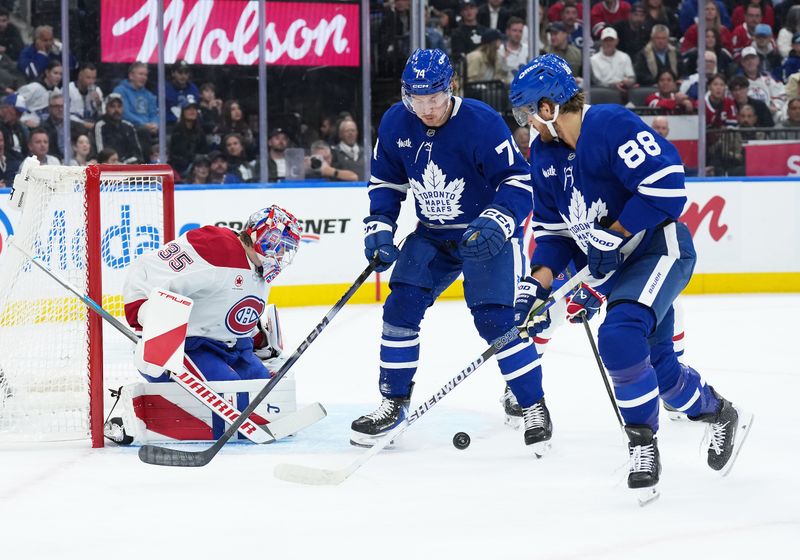 Oct 8, 2025; Toronto, Ontario, CAN; Toronto Maple Leafs right wing William Nylander (88) battles for the puck in front of Montreal Canadiens goaltender Sam Montembeault (35) during the first period at Scotiabank Arena. Mandatory Credit: Nick Turchiaro-Imagn Images