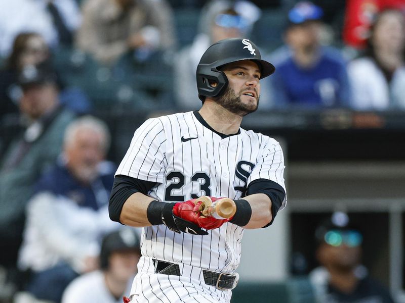 May 24, 2025; Chicago, Illinois, USA; Chicago White Sox designated hitter Andrew Benintendi (23) hits a two-run double against the Texas Rangers during the sixth inning at Rate Field. Mandatory Credit: Kamil Krzaczynski-Imagn Images