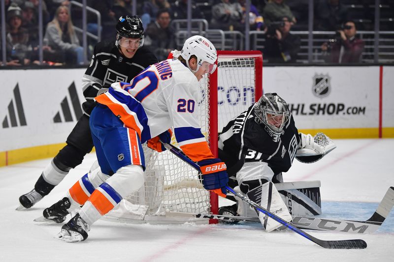 Mar 11, 2024; Los Angeles, California, USA; /New York Islanders right wing Hudson Fasching (20) moves in for a shot against Los Angeles Kings defenseman Andreas Englund (5) and goaltender David Rittich (31) during the first period at Crypto.com Arena. Mandatory Credit: Gary A. Vasquez-USA TODAY Sports