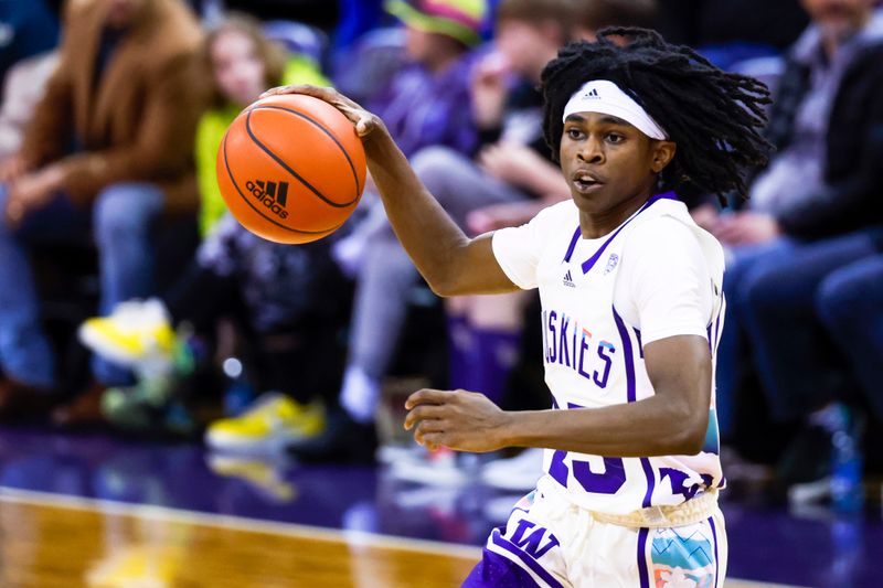 Feb 18, 2023; Seattle, Washington, USA; Washington Huskies guard Keyon Menifield (23) dribbles against the Oregon State Beavers during the second half at Alaska Airlines Arena at Hec Edmundson Pavilion. Mandatory Credit: Joe Nicholson-USA TODAY Sports