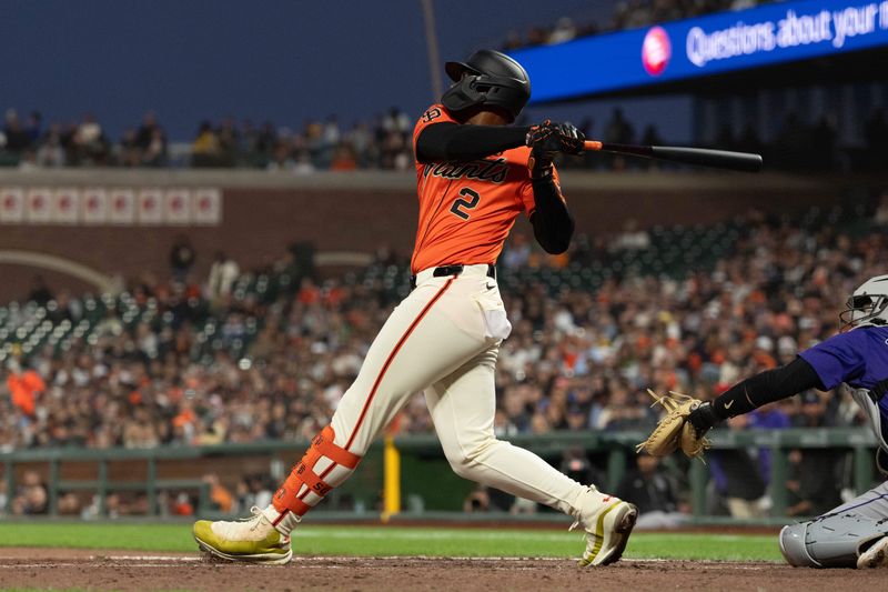 Jul 26, 2024; San Francisco, California, USA;  San Francisco Giants designated hitter Jorge Soler (2) hits a RBI single during the fourth inning against the Colorado Rockies at Oracle Park. Mandatory Credit: Stan Szeto-USA TODAY Sports