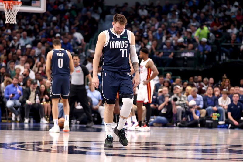 DALLAS, TEXAS - MARCH 07: Luka Doncic #77 of the Dallas Mavericks walks on the court in the first half against the Miami Heat at American Airlines Center on March 07, 2024 in Dallas, Texas.  NOTE TO USER: User expressly acknowledges and agrees that, by downloading and or using this photograph, User is consenting to the terms and conditions of the Getty Images License Agreement. (Photo by Tim Heitman/Getty Images)