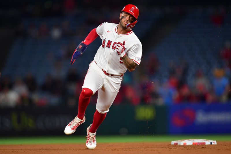 Jun 18, 2024; Anaheim, California, USA; Los Angeles Angels shortstop Zach Neto (9) runs to third against the Milwaukee Brewers during the ninth inning at Angel Stadium. Mandatory Credit: Gary A. Vasquez-USA TODAY Sports