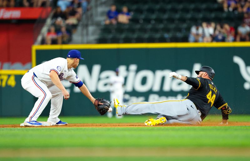 Aug 20, 2024; Arlington, Texas, USA; Pittsburgh Pirates first baseman Rowdy Tellez (44) slides safely into second base ahead of the tag by Texas Rangers shortstop Corey Seager (5) during the ninth inning  at Globe Life Field. Mandatory Credit: Kevin Jairaj-USA TODAY Sports