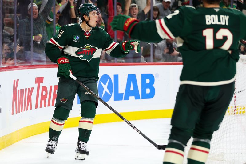 Oct 10, 2024; Saint Paul, Minnesota, USA; Minnesota Wild center Joel Eriksson Ek (14) celebrates his goal against the Columbus Blue Jackets during the second period at Xcel Energy Center. Mandatory Credit: Matt Krohn-Imagn Images