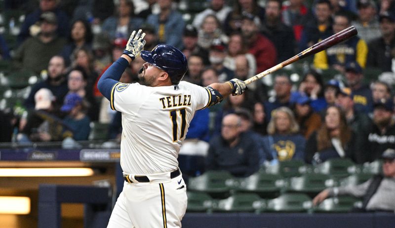 Apr 25, 2023; Milwaukee, Wisconsin, USA;  Milwaukee Brewers first baseman Rowdy Tellez (11) hits a solo home run in the sixth inning against the Detroit Tigers at American Family Field. Mandatory Credit: Michael McLoone-USA TODAY Sports