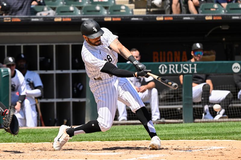 May 15, 2024; Chicago, Illinois, USA;  Chicago White Sox outfielder Tommy Pham (28) hits an RBI double against the Washington Nationals during the third inning bat Guaranteed Rate Field. Mandatory Credit: Matt Marton-USA TODAY Sports