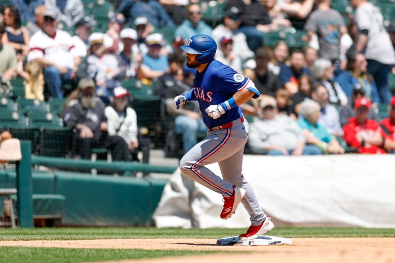 May 25, 2025; Chicago, Illinois, USA; Texas Rangers first baseman Jake Burger (21) rounds the bases after hitting a two-run home run against the Chicago White Sox during the second inning at Rate Field. Mandatory Credit: Kamil Krzaczynski-Imagn Images