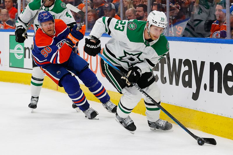May 29, 2024; Edmonton, Alberta, CAN; Dallas Stars defensemen Esa Lindell (23) moves the puck in front of Edmonton Oilers forward Corey Perry (90) during the first period in game four of the Western Conference Final of the 2024 Stanley Cup Playoffs at Rogers Place. Mandatory Credit: Perry Nelson-USA TODAY Sports