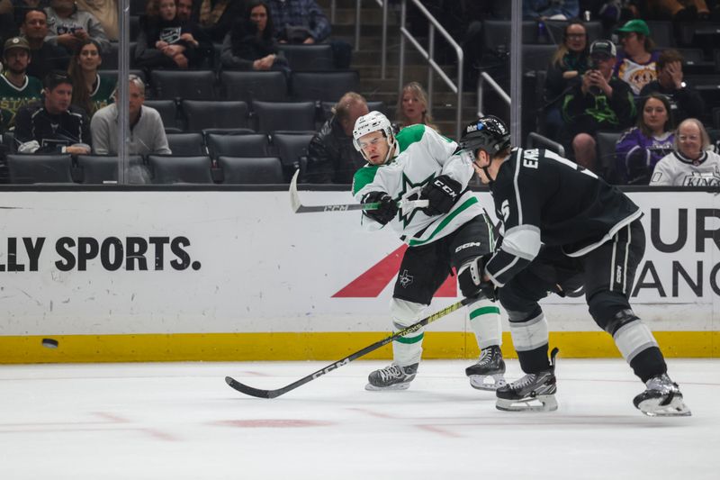 Mar 9, 2024; Los Angeles, California, USA; Dallas Stars center Logan Stankoven (11) moves the puck as Los Angeles Kings defensemen Andreas Englund (5) defends during the third period at Crypto.com Arena. Mandatory Credit: Yannick Peterhans-USA TODAY Sports