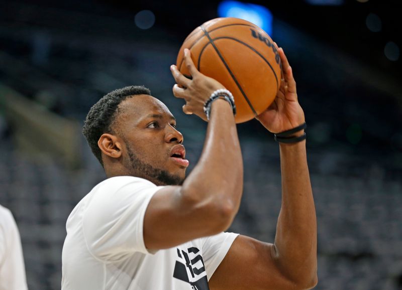 SAN ANTONIO, TX - DECEMBER 4:  Charles Bassey #28 of the San Antonio Spurs takes warm up shots before their game against the Phoenix Sunsat AT&T Center on December 4, 2022 in San Antonio, Texas. NOTE TO USER: User expressly acknowledges and agrees that, by downloading and or using this photograph, User is consenting to terms and conditions of the Getty Images License Agreement. (Photo by Ronald Cortes/Getty Images)