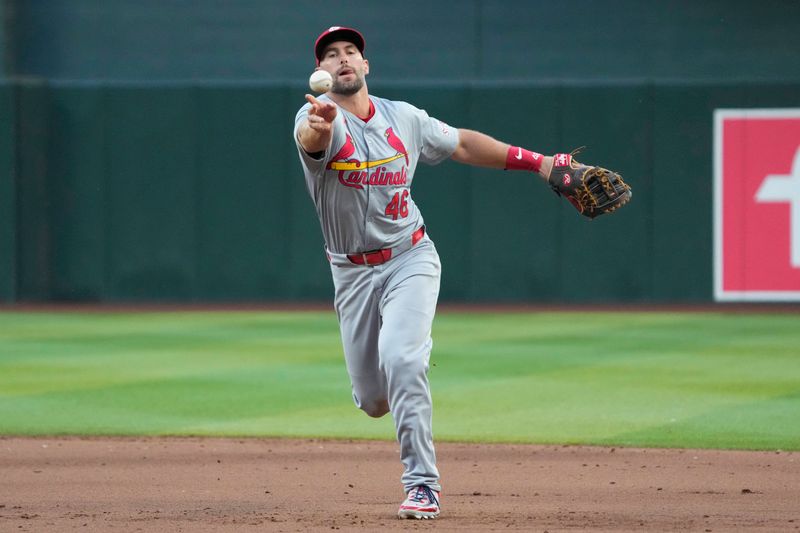 Apr 13, 2024; Phoenix, Arizona, USA; St. Louis Cardinals first baseman Paul Goldschmidt (46) flips the ball for an out against the St. Louis Cardinals in the fifth inning at Chase Field. Mandatory Credit: Rick Scuteri-USA TODAY Sports