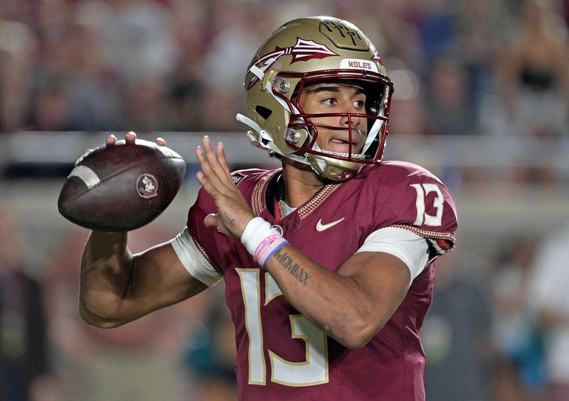 Oct 21, 2023; Tallahassee, Florida, USA; Florida State Seminoles quarterback Jordan Travis (13) looks to throw during the first half against the Duke Blue Devils at Doak S. Campbell Stadium. Mandatory Credit: Melina Myers-USA TODAY Sports