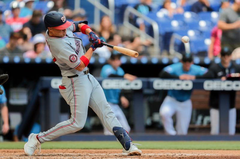 Apr 13, 2025; Miami, Florida, USA; Washington Nationals right fielder Alex Call (17) hits an RBI single against the Miami Marlins during the fourth inning at loanDepot Park. Mandatory Credit: Sam Navarro-Imagn Images