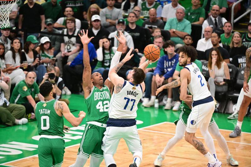 BOSTON, MA - JUNE 17: Luka Doncic #77 of the Dallas Mavericks shoots the ball during the game against the Boston Celtics during Game Five of the 2024 NBA Finals on June 17, 2024 at the TD Garden in Boston, Massachusetts. NOTE TO USER: User expressly acknowledges and agrees that, by downloading and or using this photograph, User is consenting to the terms and conditions of the Getty Images License Agreement. Mandatory Copyright Notice: Copyright 2024 NBAE  (Photo by Adam Hagy/NBAE via Getty Images)