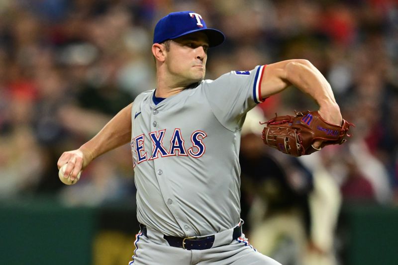 Aug 23, 2024; Cleveland, Ohio, USA; Texas Rangers relief pitcher David Robertson (37) throws a pitch during the eighth inning against the Cleveland Guardians at Progressive Field. Mandatory Credit: Ken Blaze-USA TODAY Sports