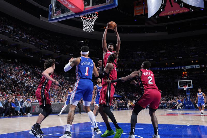 PHILADELPHIA, PA - MARCH 18: Thomas Bryant #31 of the Miami Heat rebounds the ball during the game against the Philadelphia 76ers on March 18, 2024 at the Wells Fargo Center in Philadelphia, Pennsylvania NOTE TO USER: User expressly acknowledges and agrees that, by downloading and/or using this Photograph, user is consenting to the terms and conditions of the Getty Images License Agreement. Mandatory Copyright Notice: Copyright 2024 NBAE (Photo by Jesse D. Garrabrant/NBAE via Getty Images)