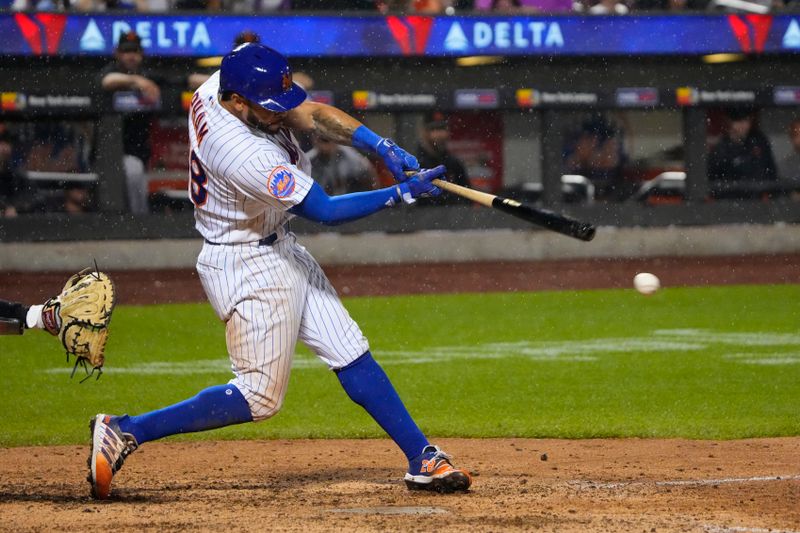 Jul 2, 2023; New York City, New York, USA; New York Mets left fielder Tommy Pham (28) hits a double against the San Francisco Giants during the eighth inning at Citi Field. Mandatory Credit: Gregory Fisher-USA TODAY Sports