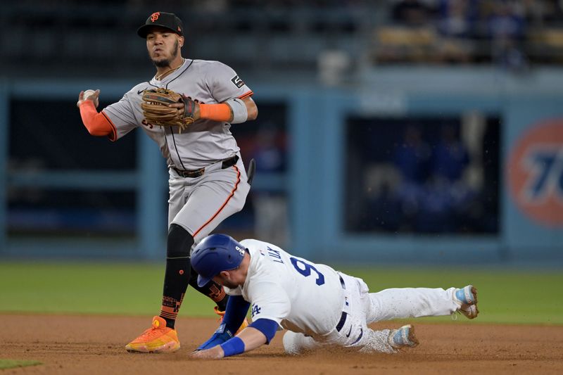 Apr 2, 2024; Los Angeles, California, USA;  Los Angeles Dodgers second baseman Gavin Lux (9) is out at second as San Francisco Giants second baseman Thairo Estrada (39) completes a double play in the eighth inning at Dodger Stadium. Mandatory Credit: Jayne Kamin-Oncea-USA TODAY Sports