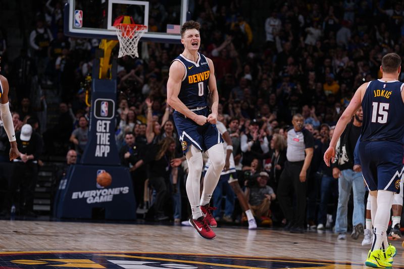 DENVER, CO - APRIL 10: Christian Braun #0 of the Denver Nuggets celebrates a dunk during the game against the Minnesota Timberwolves on April 10, 2024 at the Ball Arena in Denver, Colorado. NOTE TO USER: User expressly acknowledges and agrees that, by downloading and/or using this Photograph, user is consenting to the terms and conditions of the Getty Images License Agreement. Mandatory Copyright Notice: Copyright 2024 NBAE (Photo by Bart Young/NBAE via Getty Images)